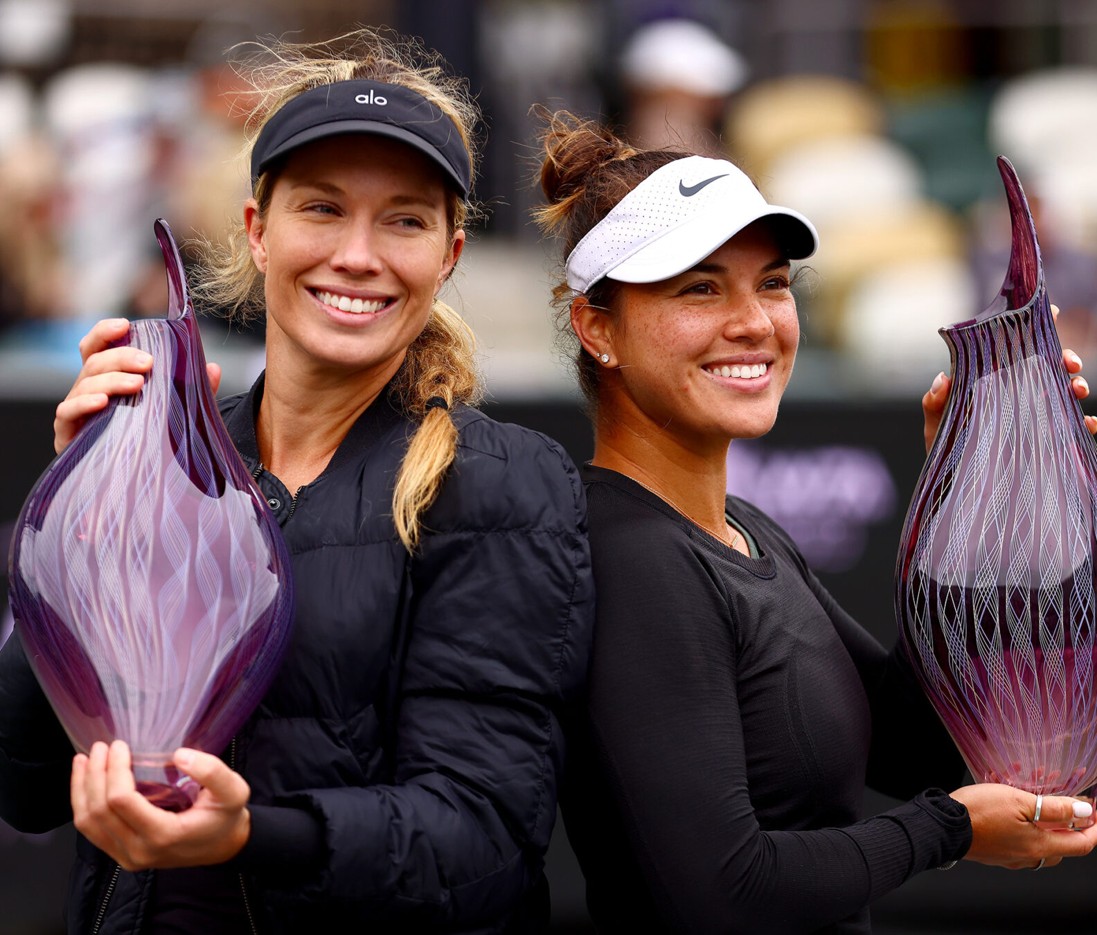 Danielle Collins (USA) & Desirae Krawczyk (USA) with their trophies. (Photo by Katelyn Mulcahy/Charleston Tennis)